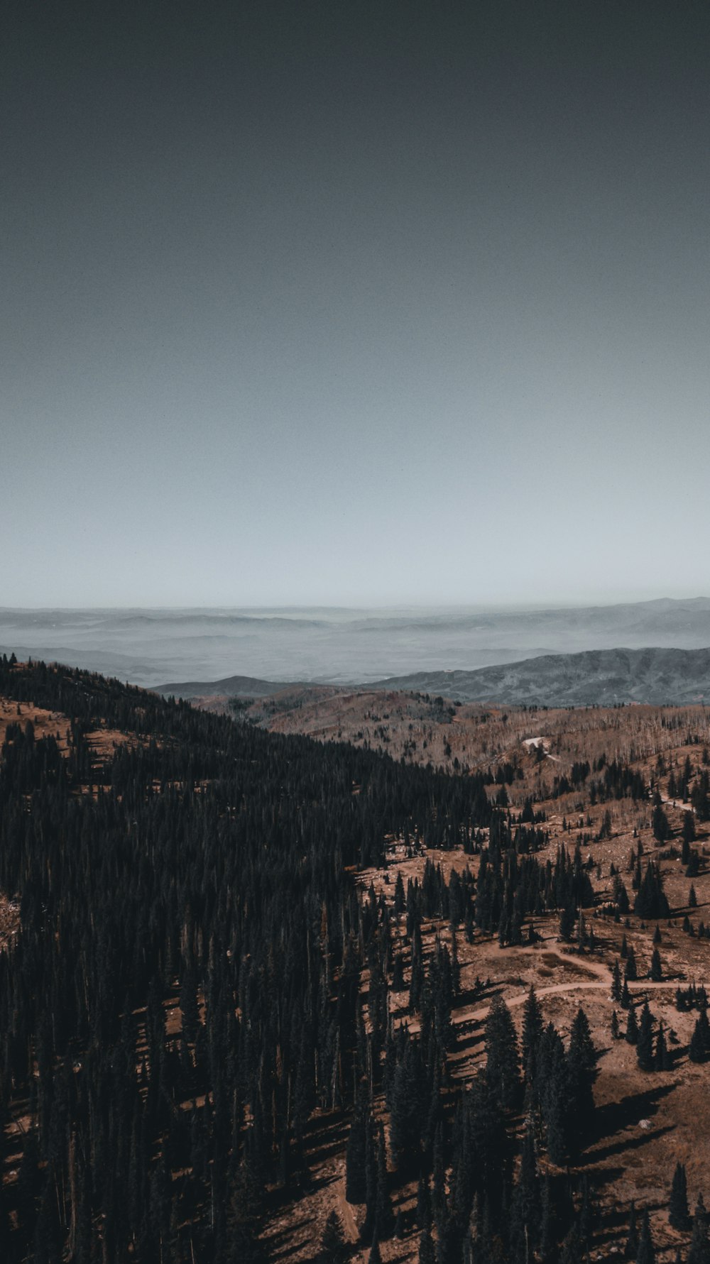 brown mountains under blue sky during daytime