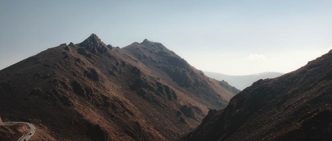 brown and green mountains under blue sky during daytime