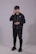 man in black zip up jacket and black pants