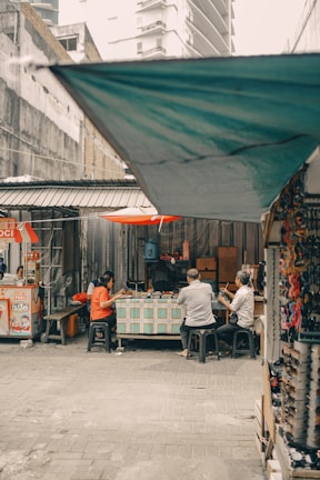 Students sharing a meal and stories at a local Enghien café, capturing moments of friendship.