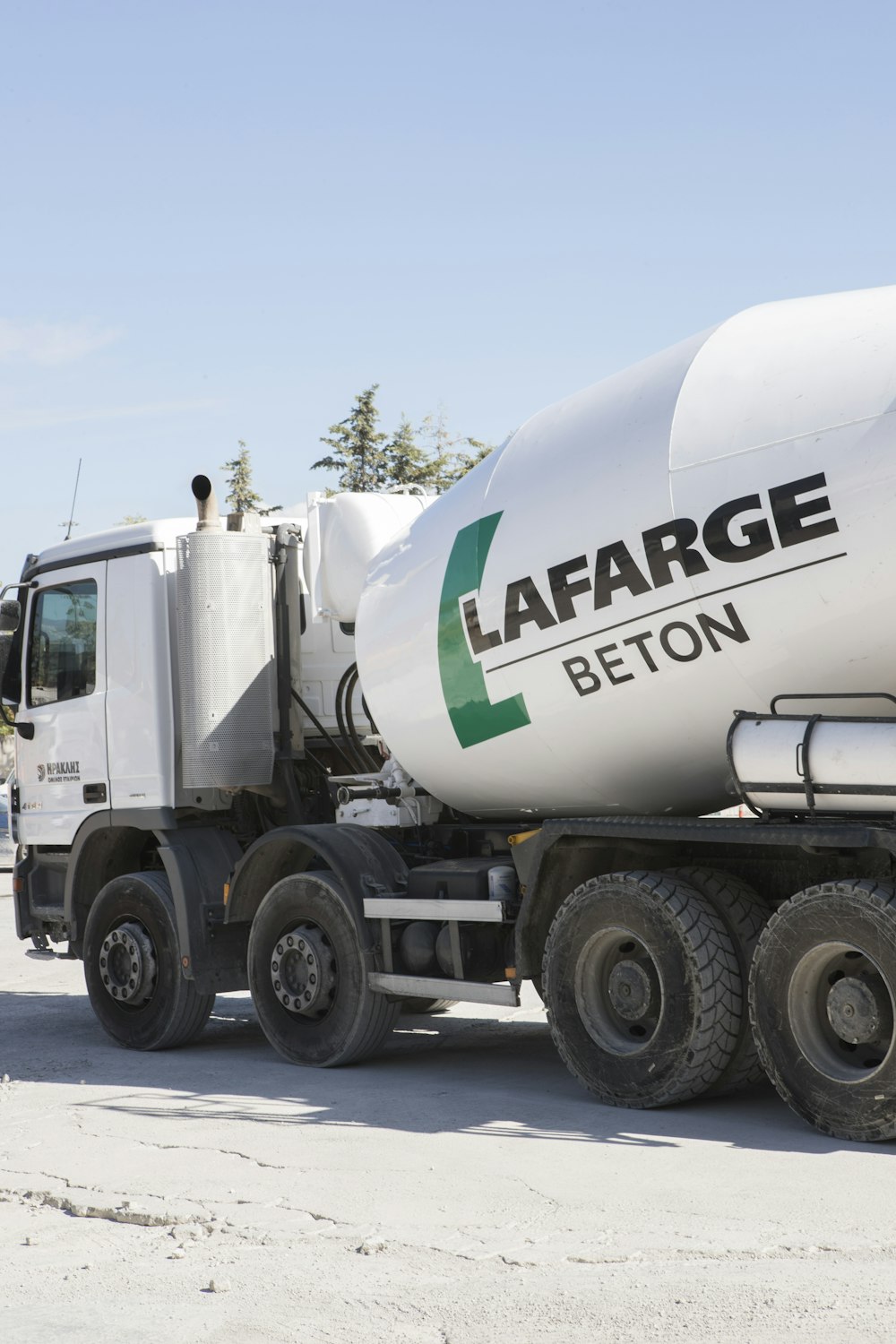 a cement truck parked on the side of the road