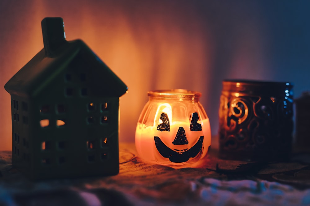 brown and white lighted candle holder