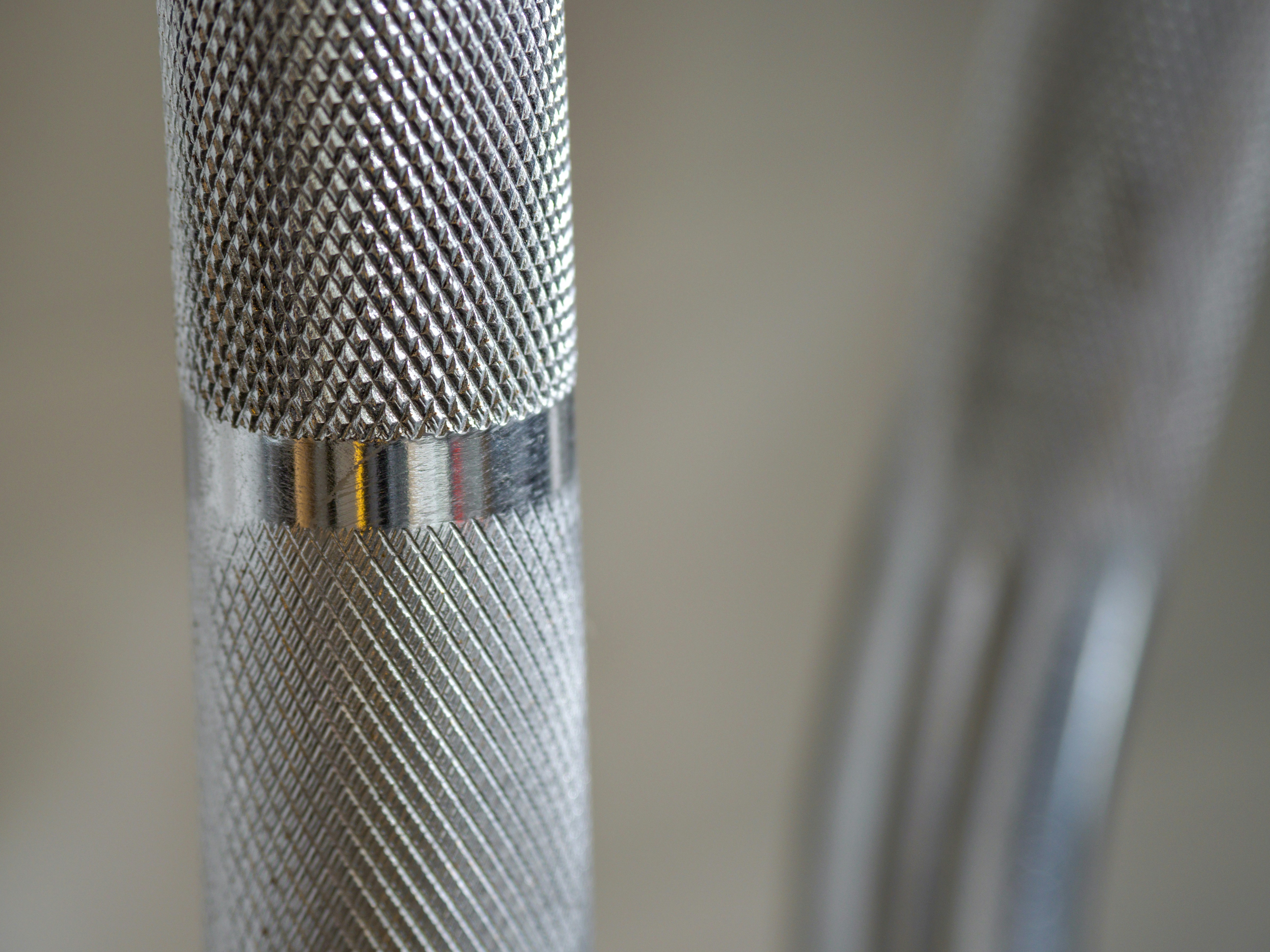 silver and gold microphone on white table