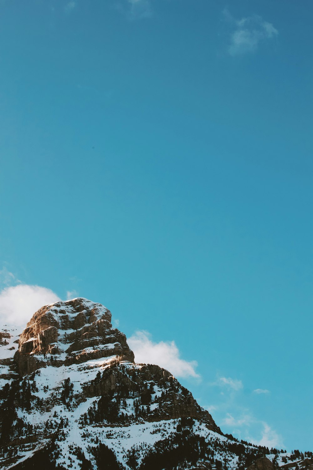 white and brown rocky mountain under blue sky during daytime