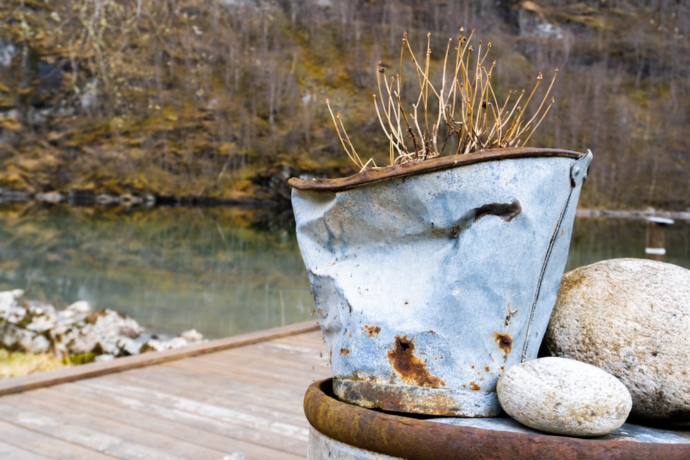 white ceramic container on brown wooden table