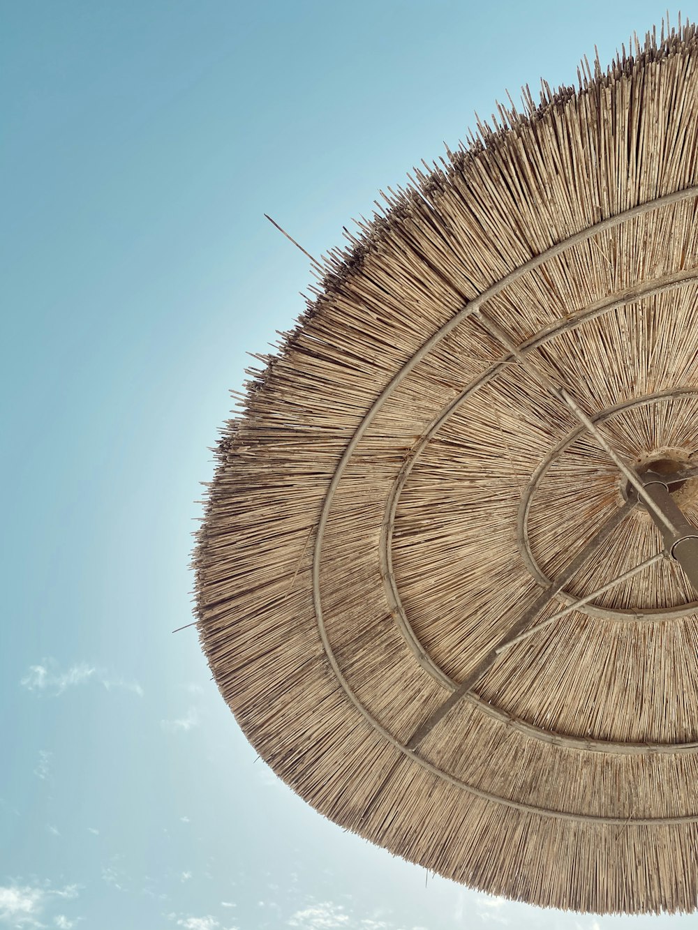 brown wooden round roof under blue sky during daytime