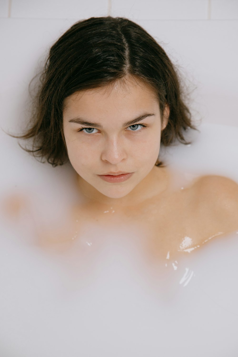 woman in bathtub with water