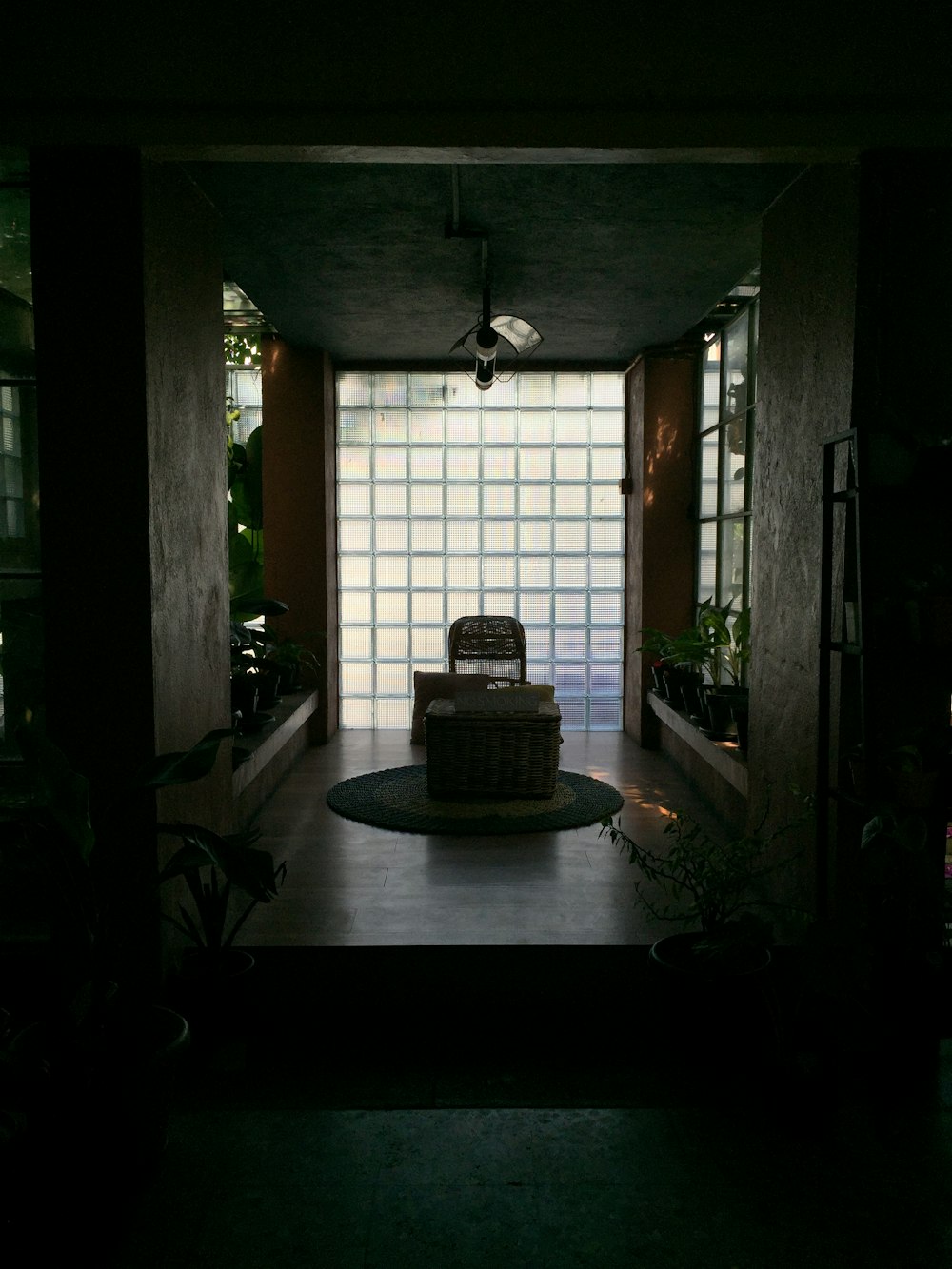 brown wooden table near window