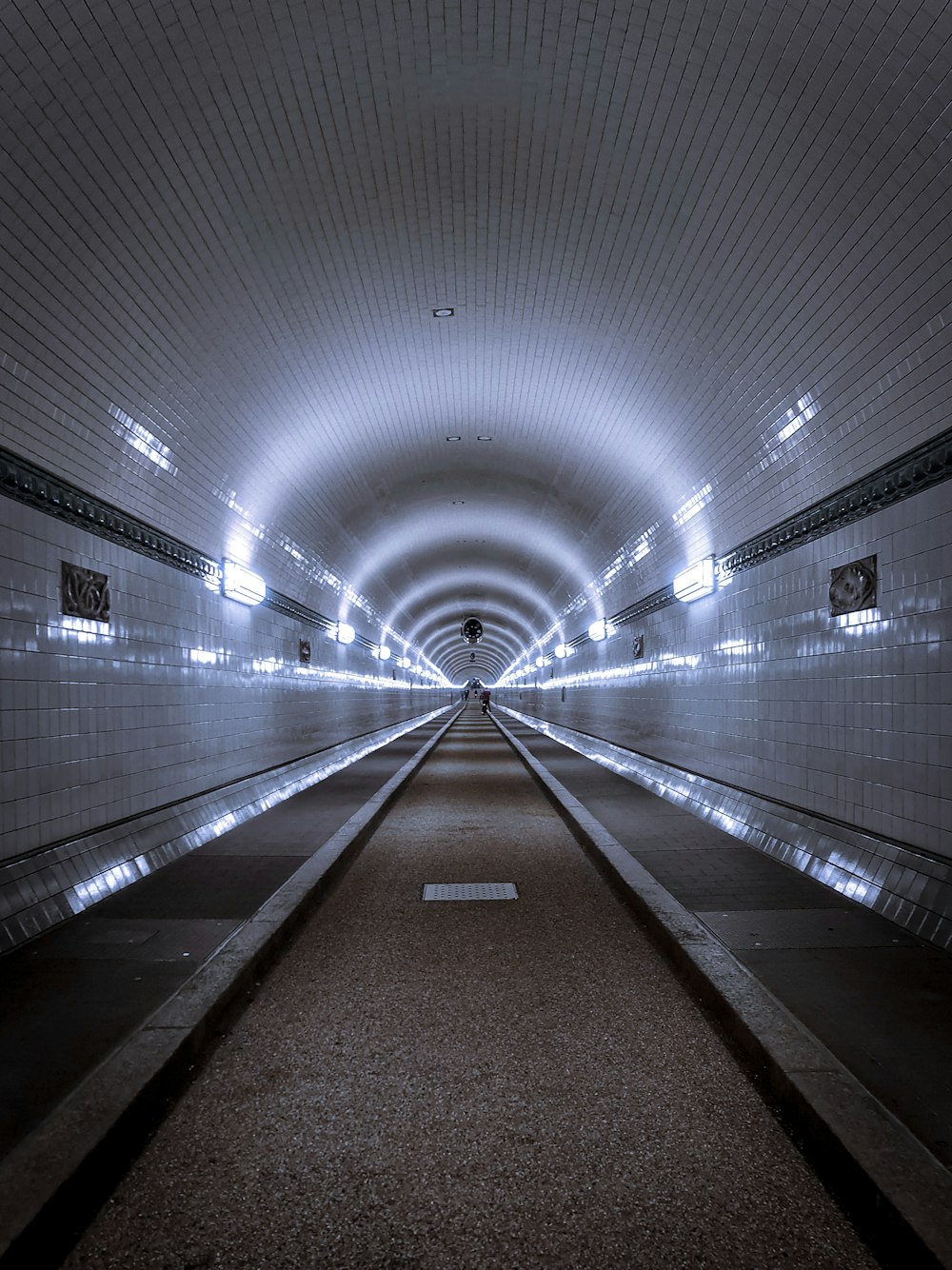 empty hallway with lights turned on in tunnel