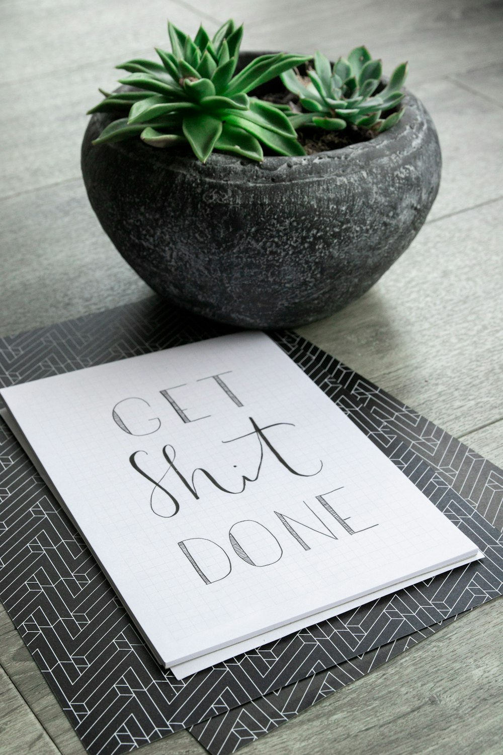 white printer paper on gray round vase