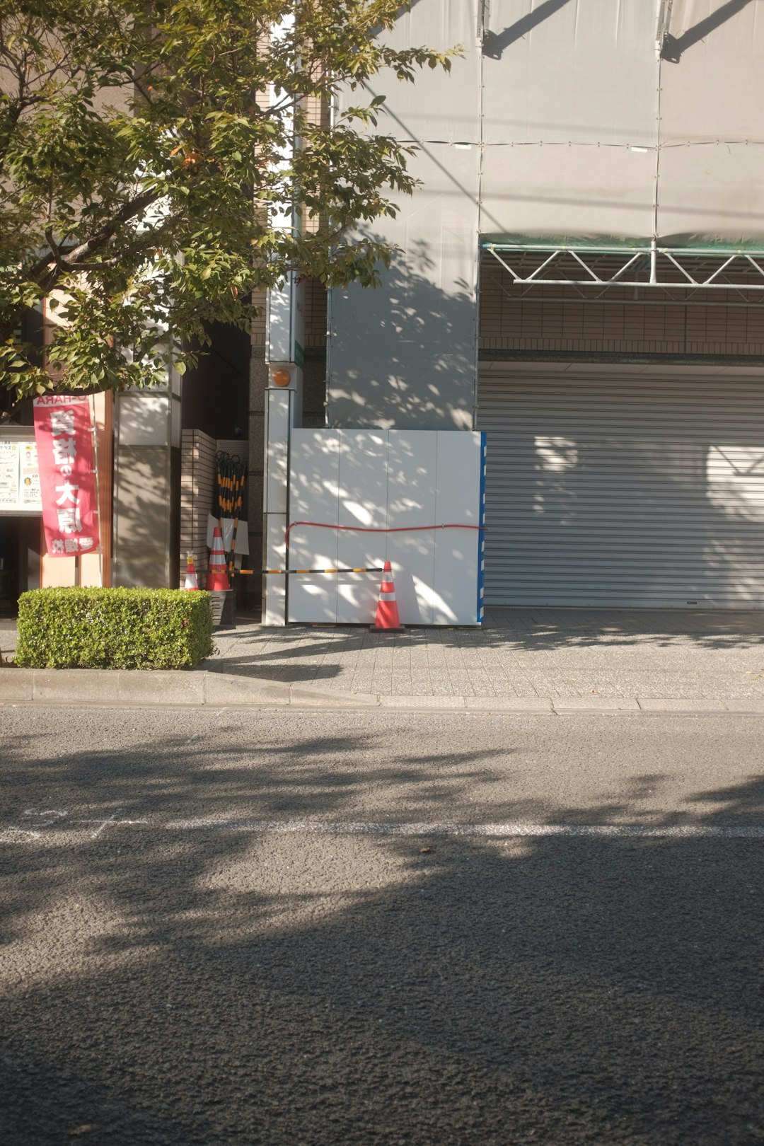 white and black building near green trees during daytime