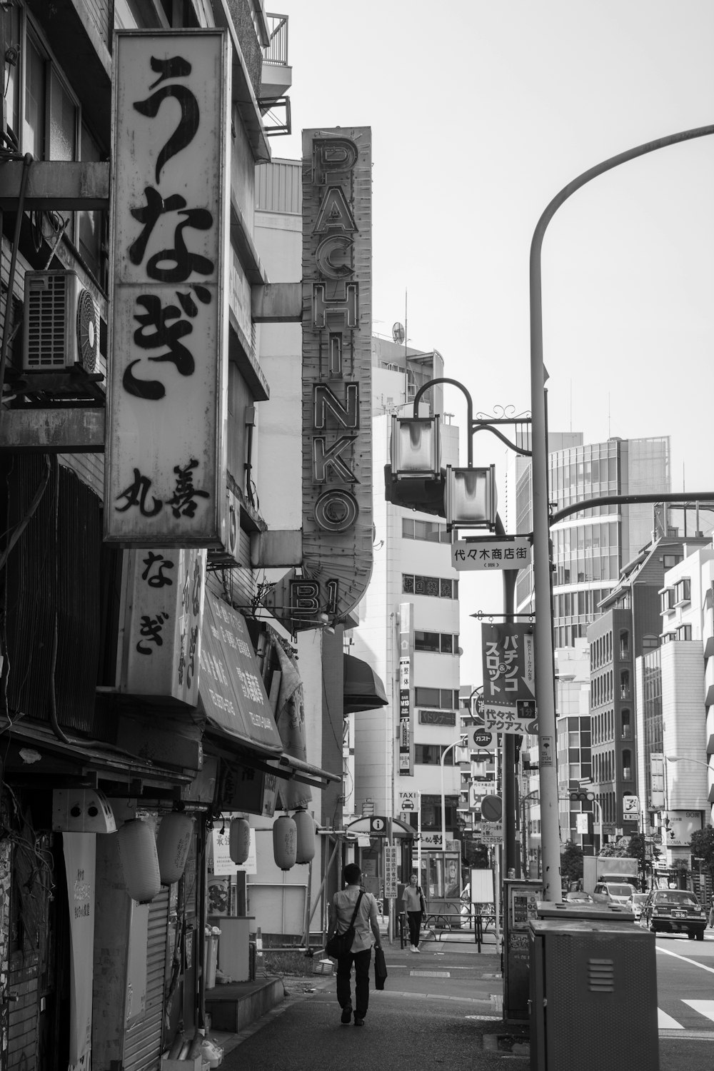 grayscale photo of city buildings