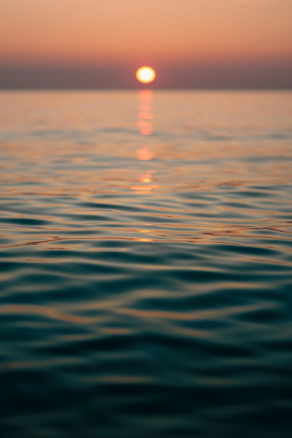 body of water during sunset