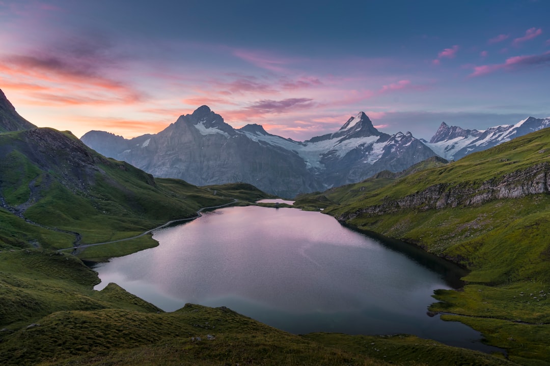 lake in the middle of green mountains