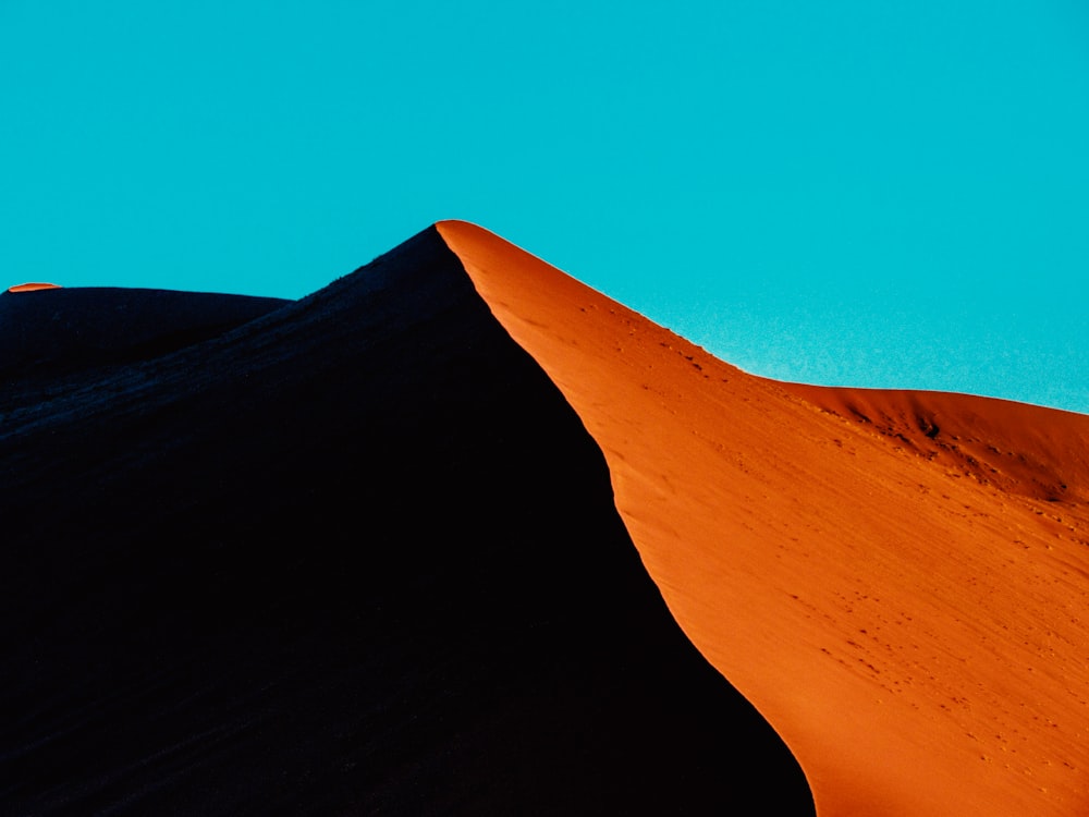 brown sand under blue sky during daytime