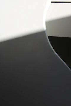 An abstract painting capturing the delicate interplay of shadow and light with soft, flowing lines.