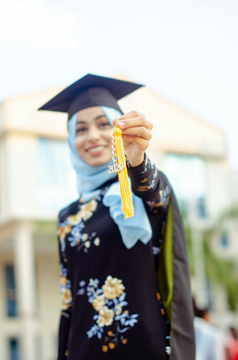 woman in academic dress wearing academic hat