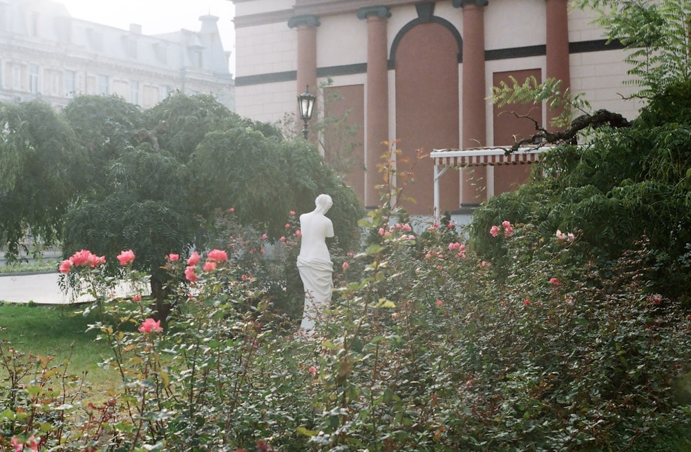 man in white thobe walking on pathway during daytime