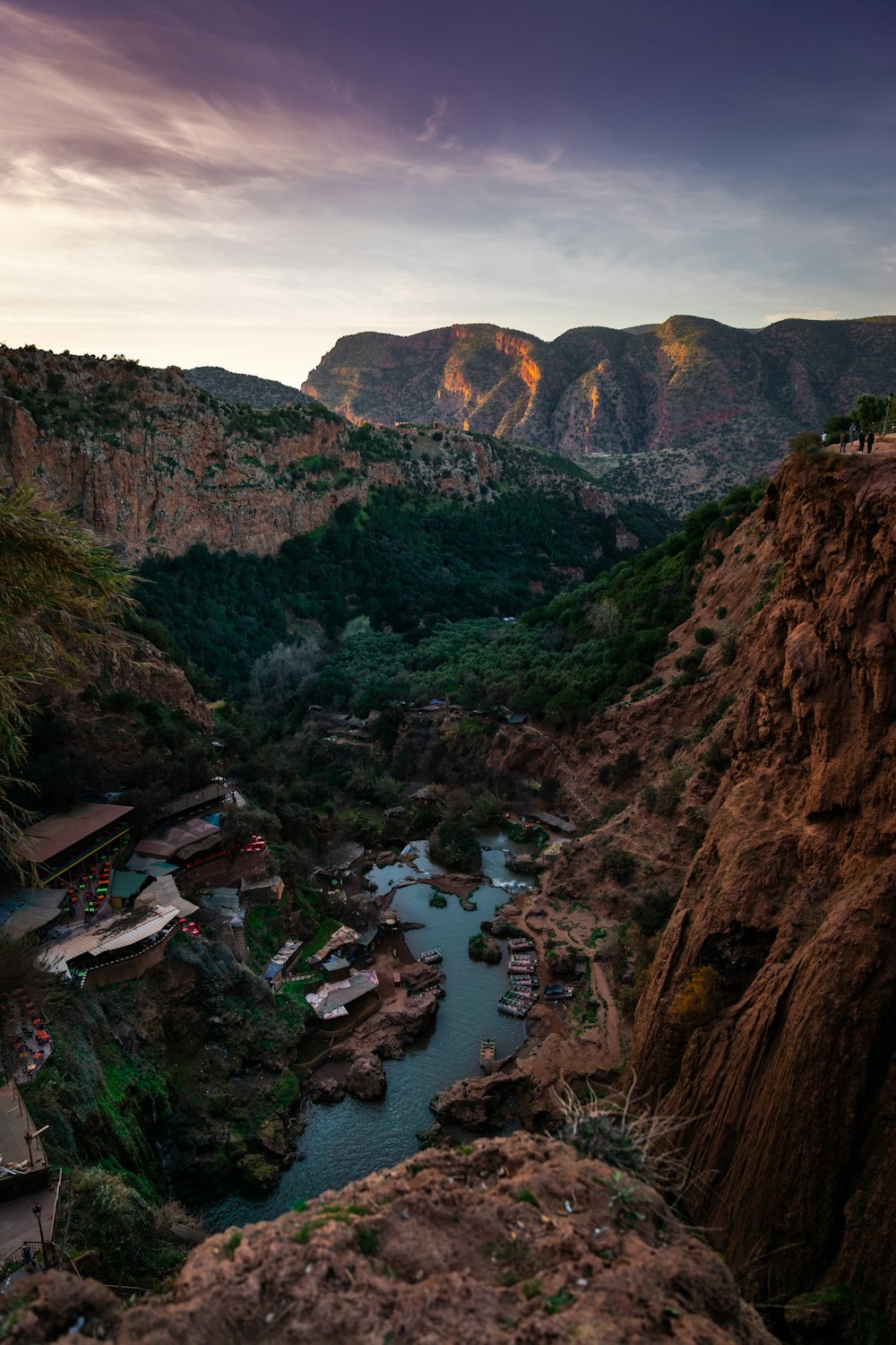 body of water between mountains during daytime