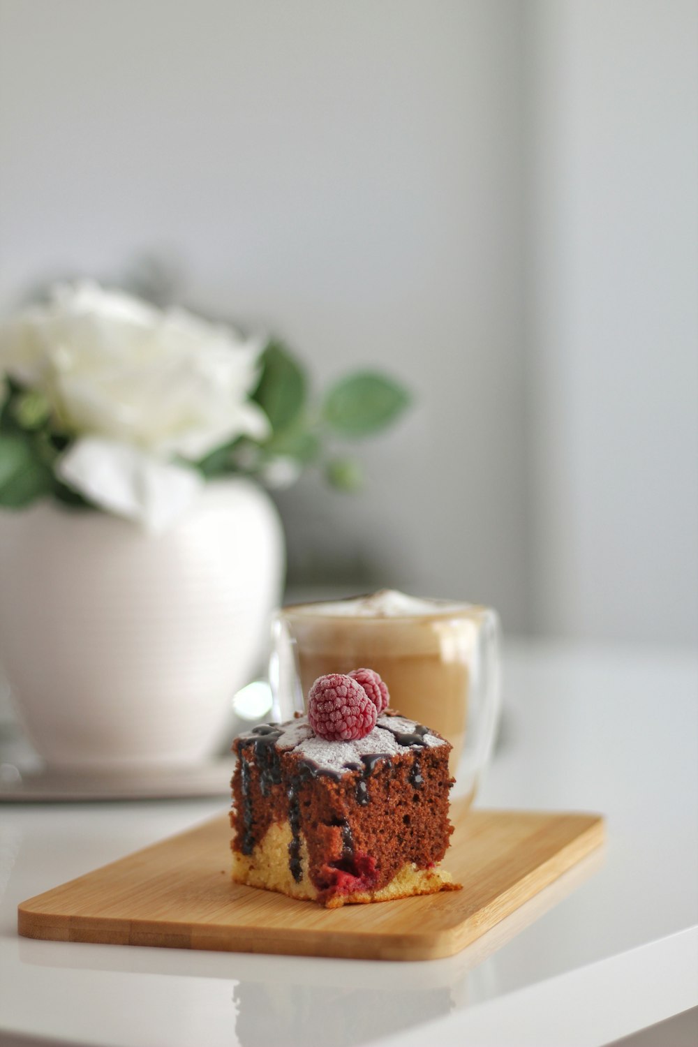 sliced chocolate cake on brown wooden chopping board