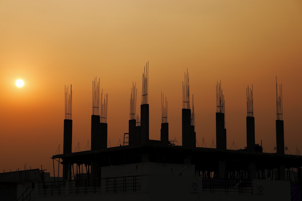 silhouette of building during sunset