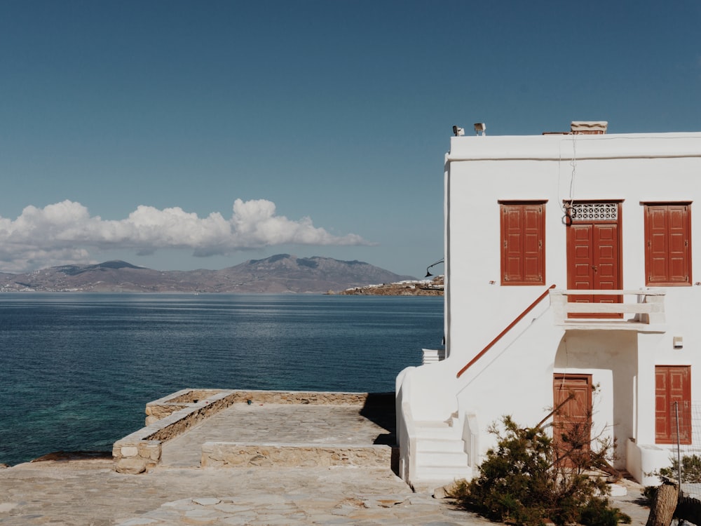 white concrete building near body of water during daytime