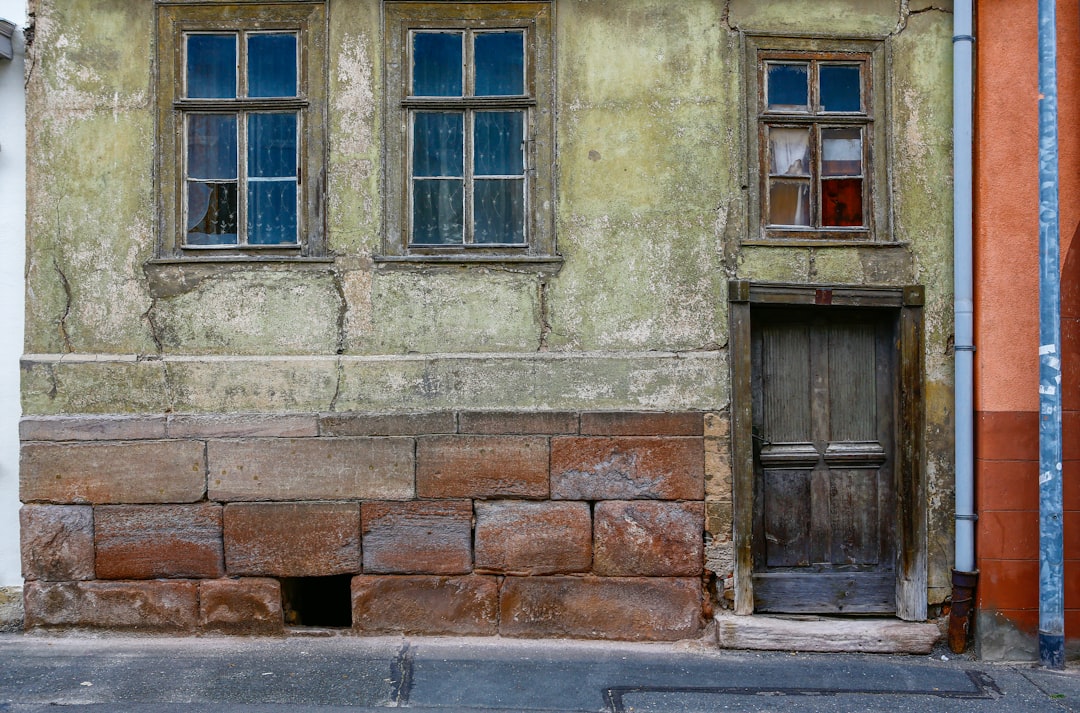 brown brick wall with brown wooden window