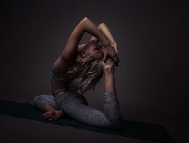Balamuraleekrishnan demonstrating a yoga pose in a serene Chennai studio.