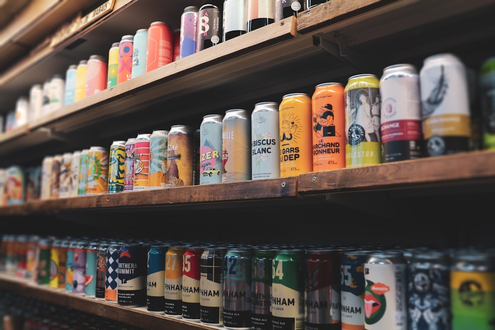 assorted plastic bottles on brown wooden shelf