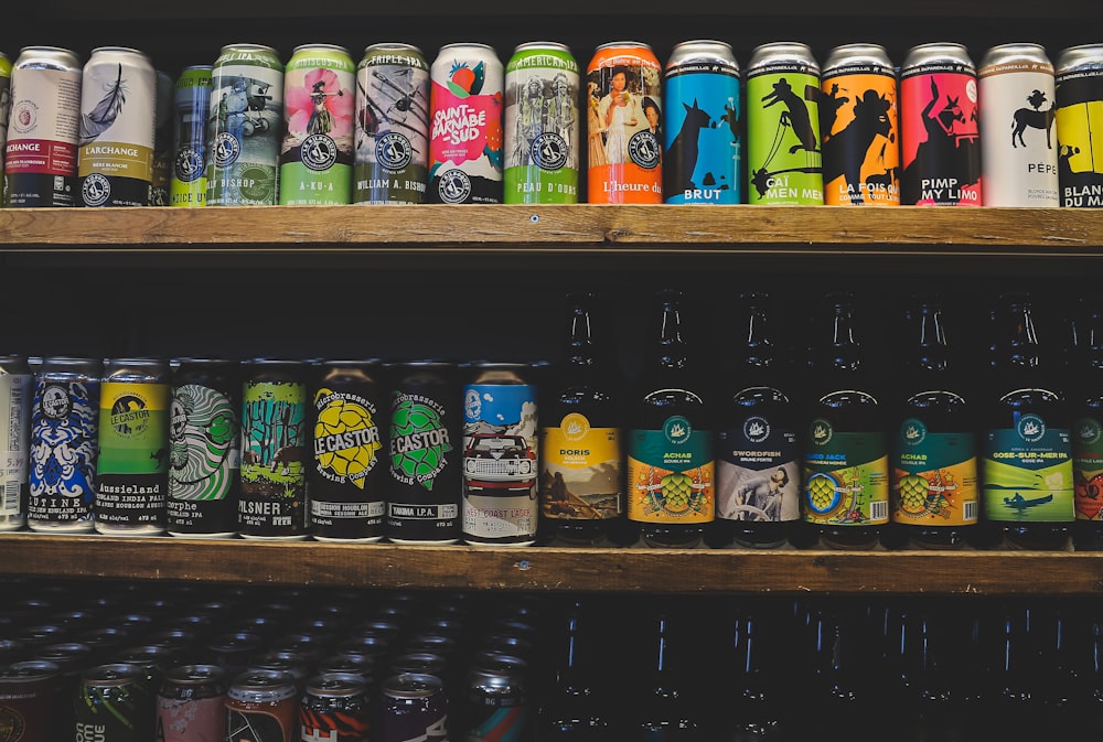 assorted bottles on brown wooden shelf