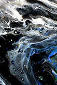 Abstract sound waves pulsing in silver and deep blue hues on a black canvas.