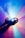 Hands are holding a crystal or prism, casting vibrant and colorful light rays. The light refracts into a spectrum of colors, producing a visually striking and ethereal effect against a softly blurred background.