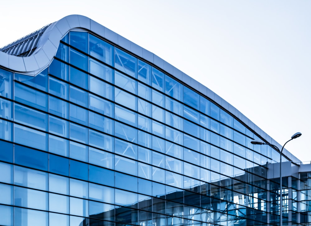 blue glass walled high rise building