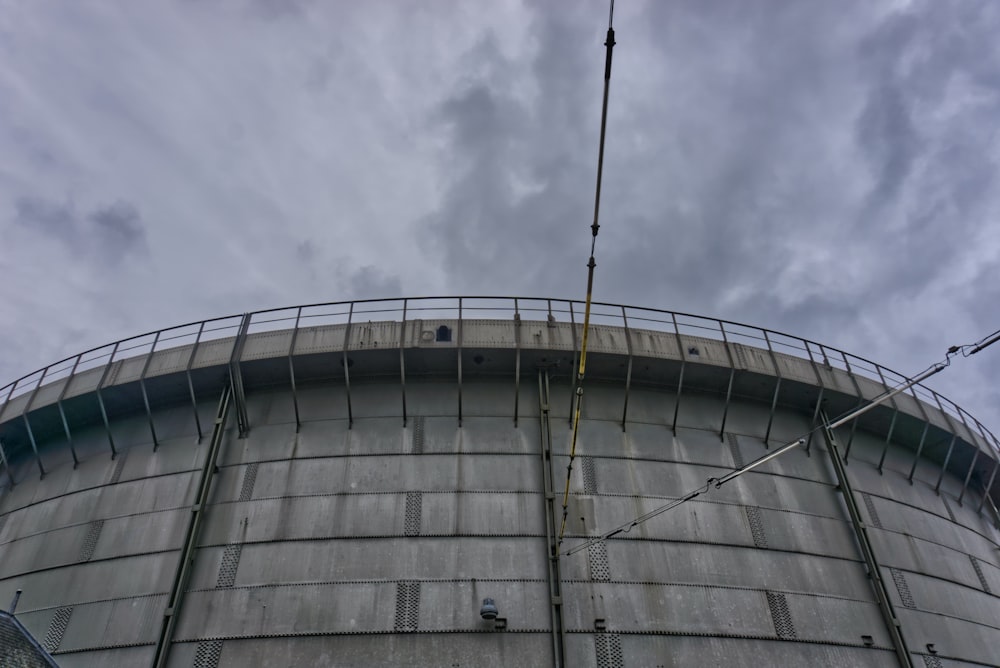 gray concrete building under white clouds during daytime