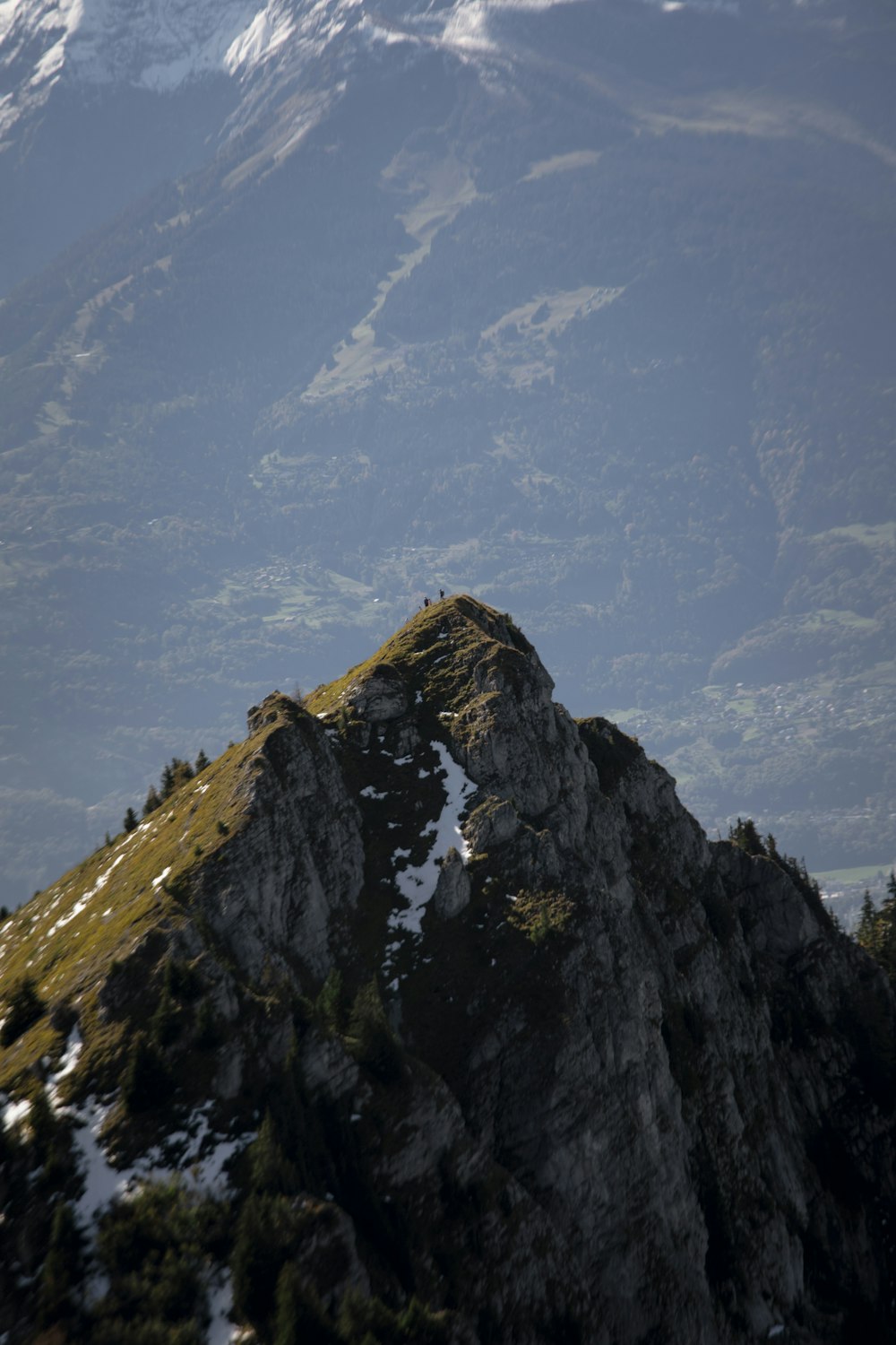 green and brown mountain under white clouds during daytime