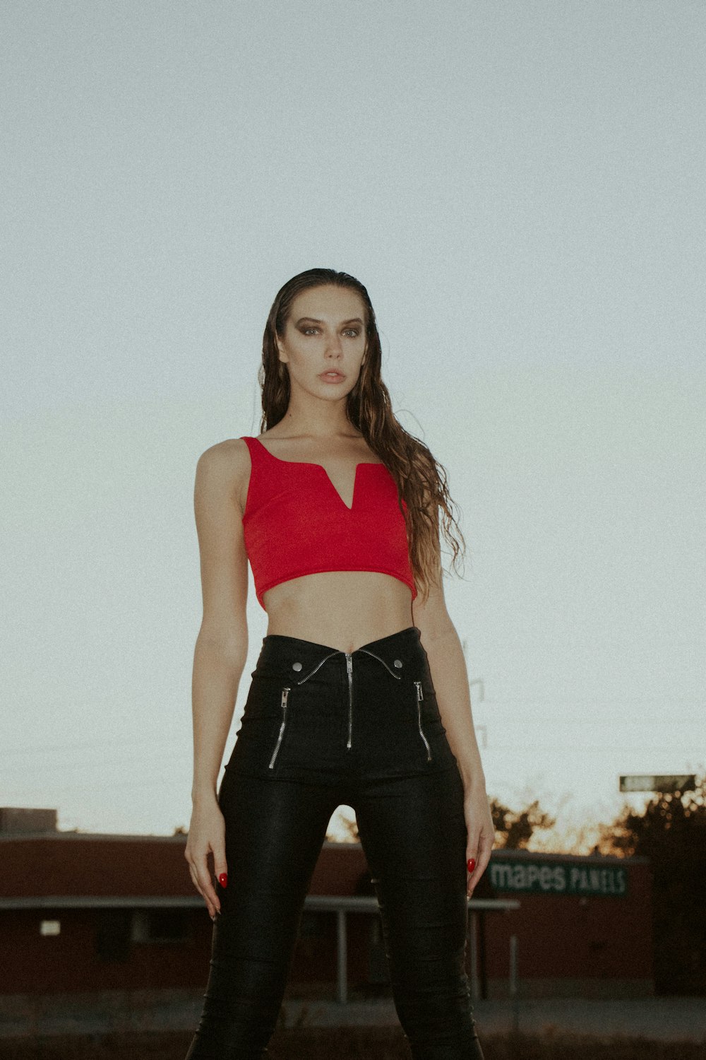 woman in red sports bra and black leggings