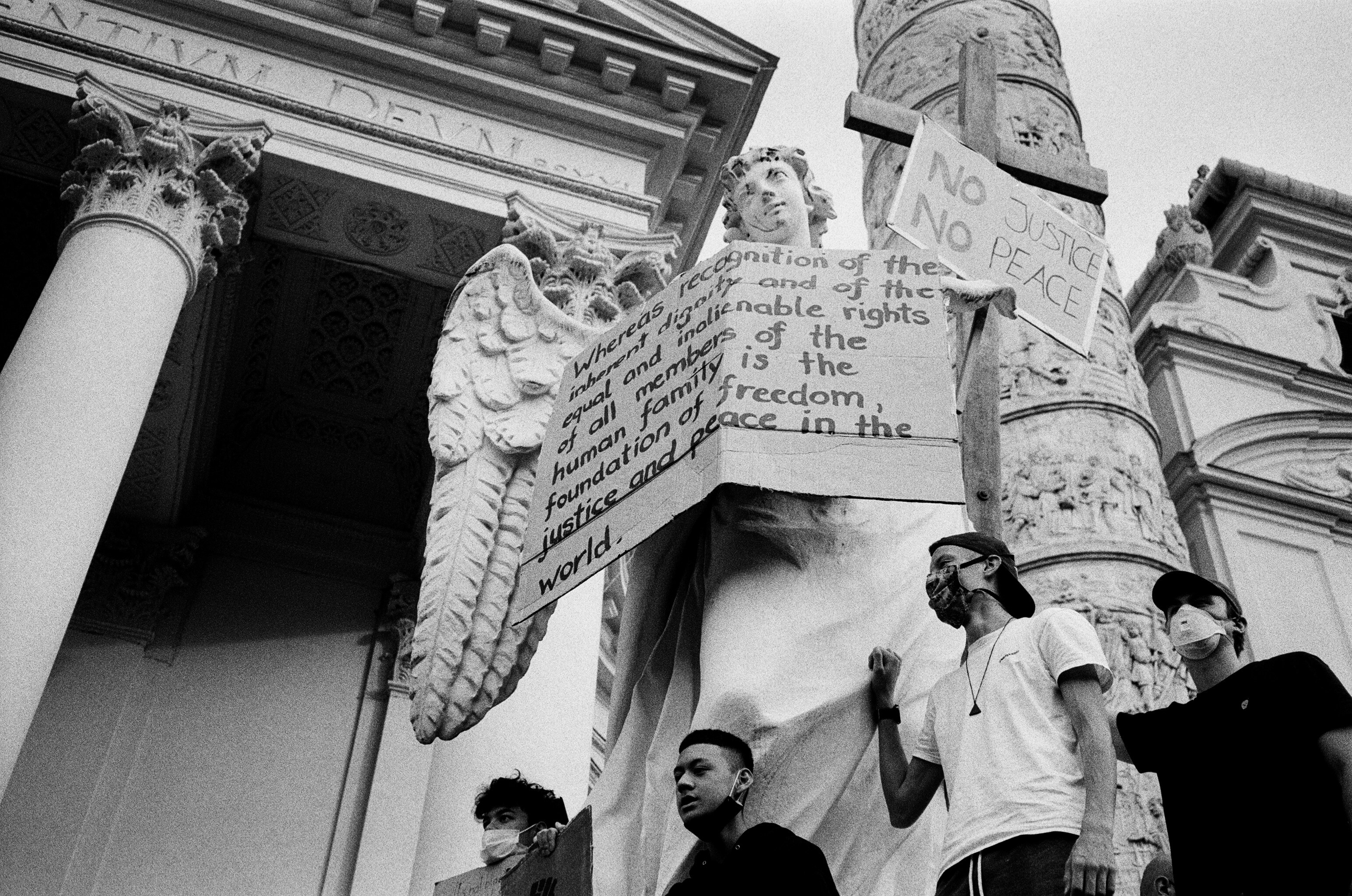 grayscale photo of man in white t-shirt and cap
