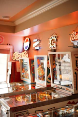 Vintage pinball machine lit up in a cozy game room.