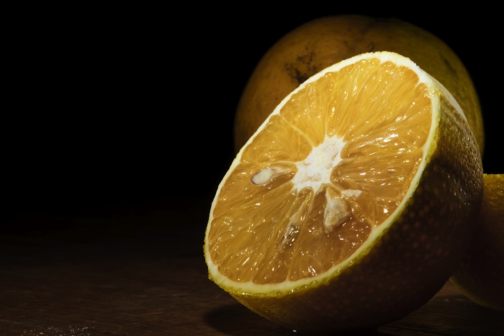 orange fruit on brown wooden table