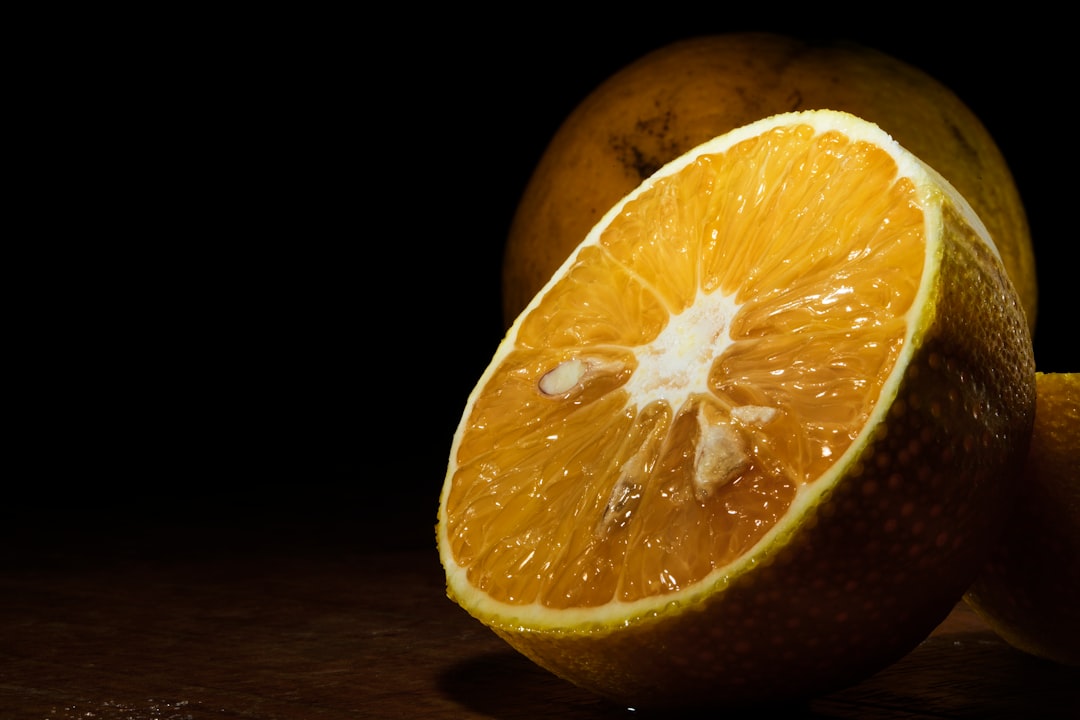 orange fruit on brown wooden table