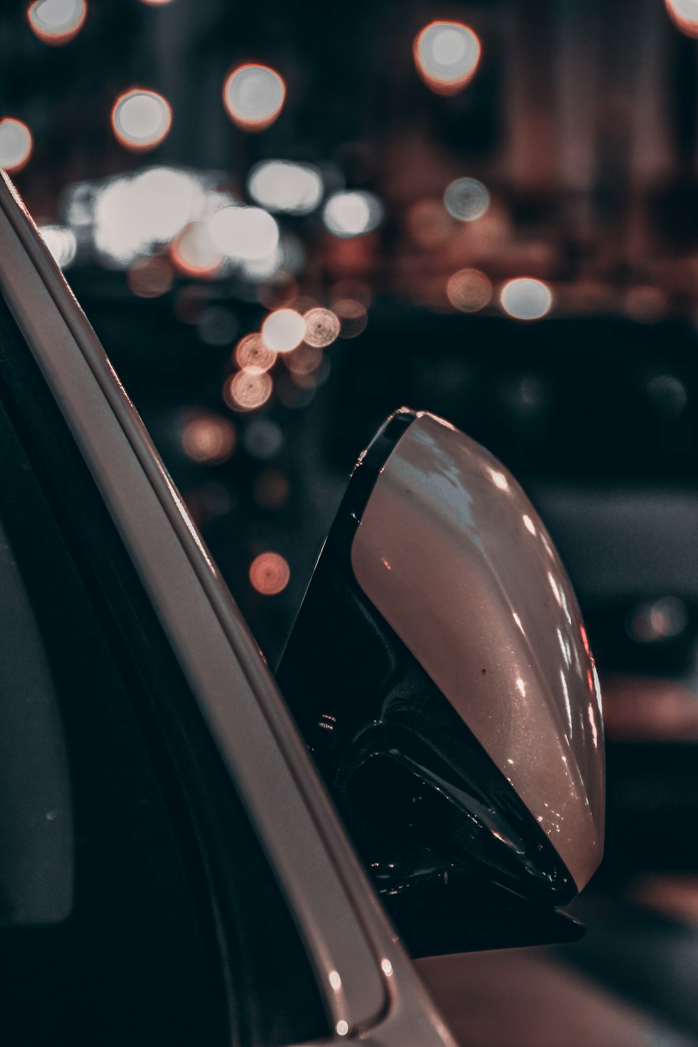 car side mirror with bokeh lights