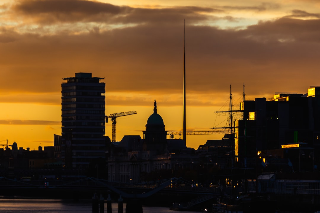 silhouette of city buildings during sunset