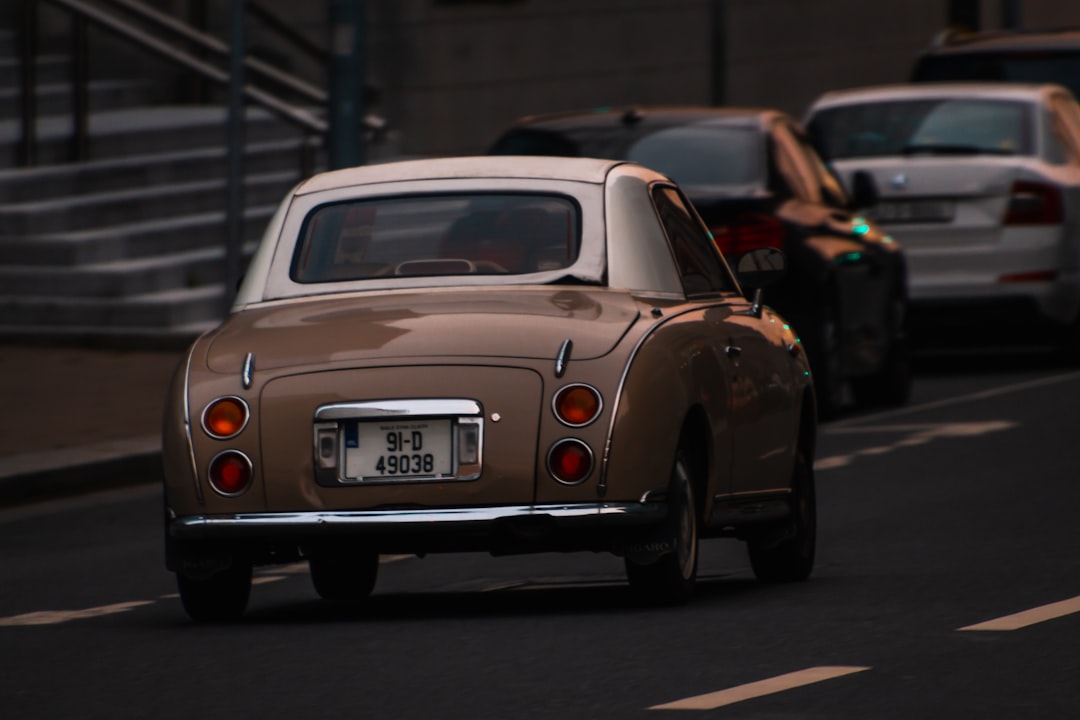 white porsche 911 on road during daytime