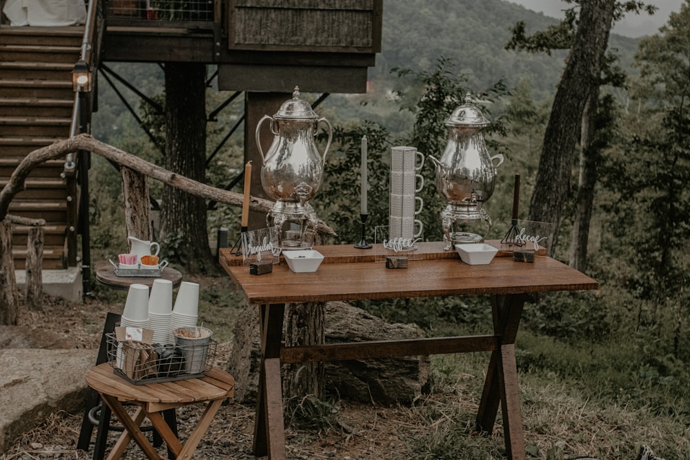 clear glass pitcher on brown wooden table