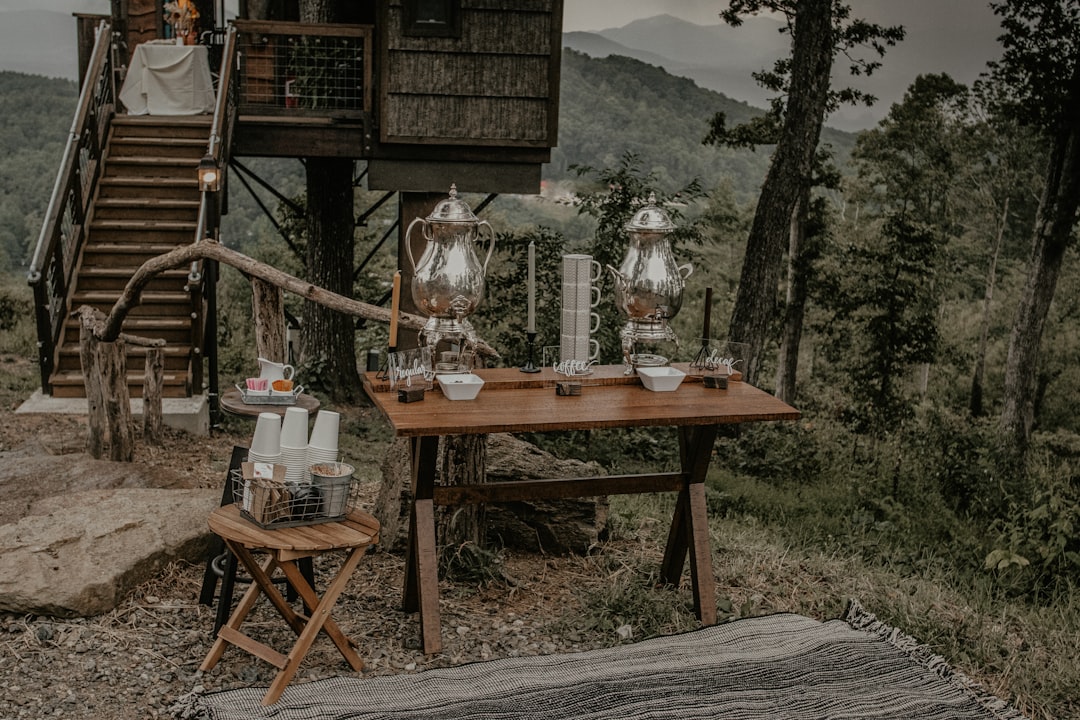 clear glass pitcher on brown wooden table