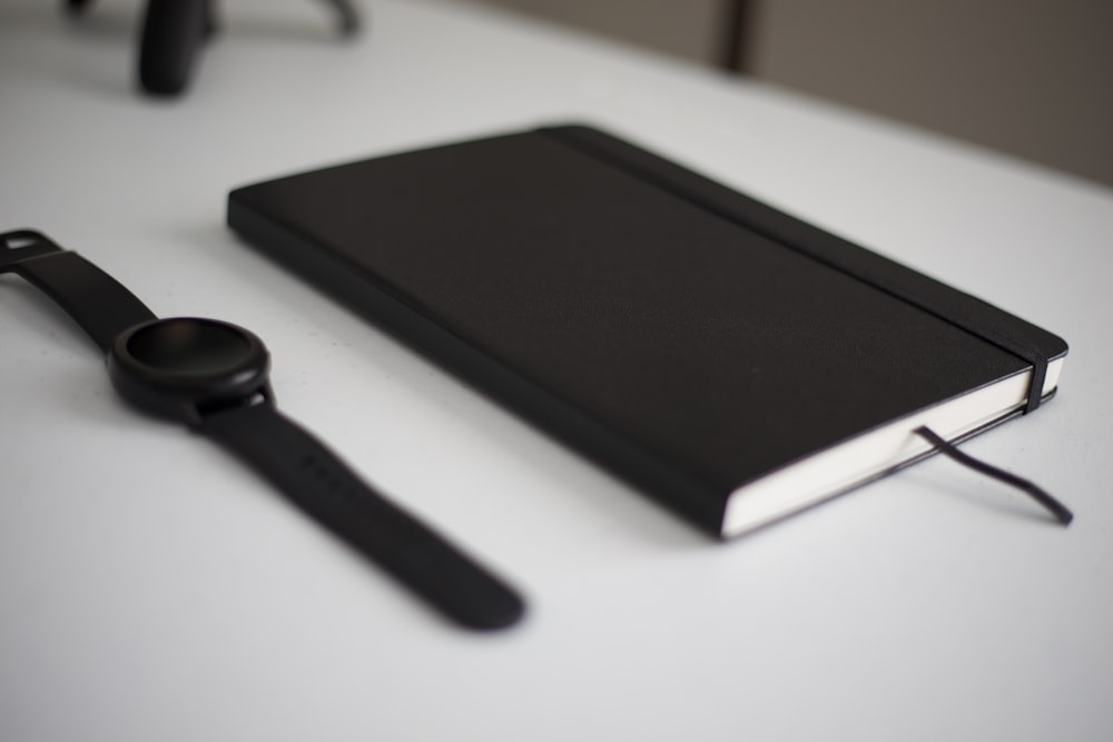 black and white android smartphone on white table