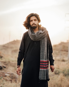 woman in black coat and gray scarf