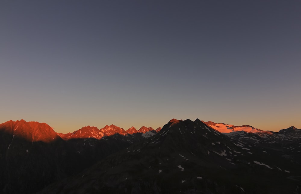 black and white mountains under blue sky during daytime