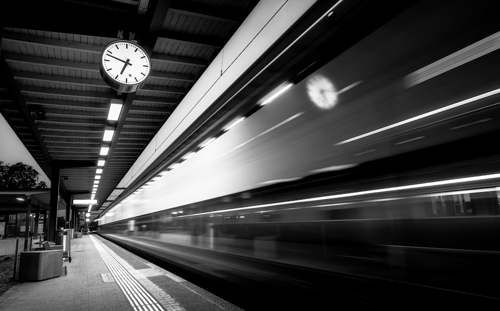 grayscale photo of a train station