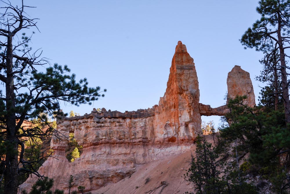 brown rock formation under blue sky during daytime